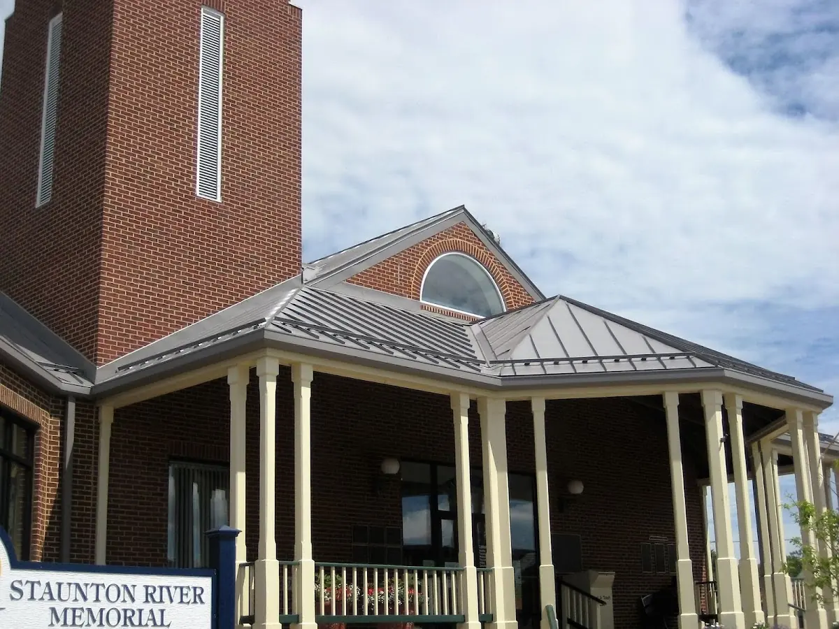 Skilled roofing craftsmen working on a residential roof in Whitestown